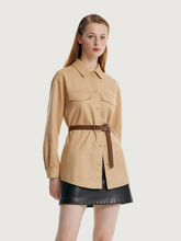 a lady in suede jacket with black mini skirt